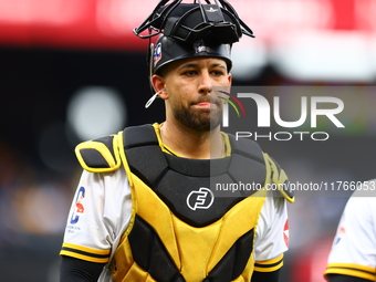 Las Aguilas Cibaenas catcher J.C Escarra #59 comes off the field during the second inning of a baseball game against Los Tigres del Licey at...