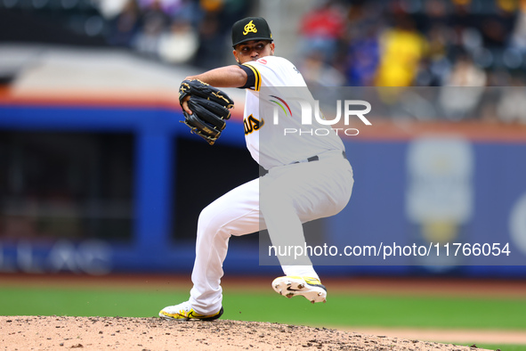 Las Aguilas Cibaenas pitcher Carlos Espinal #70 throws during the sixth inning of a baseball game against Los Tigres del Licey at Citi Field...