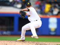 Las Aguilas Cibaenas pitcher Carlos Espinal #70 throws during the sixth inning of a baseball game against Los Tigres del Licey at Citi Field...