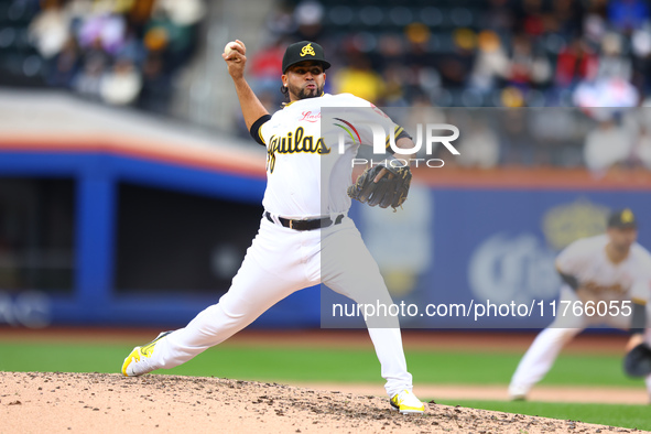 Las Aguilas Cibaenas pitcher Carlos Espinal #70 throws during the sixth inning of a baseball game against Los Tigres del Licey at Citi Field...