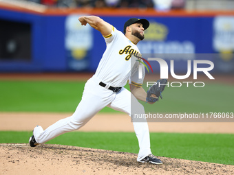 Las Aguilas Cibaenas pitcher Junior Fernandez #73 throws during the ninth inning of a baseball game against Los Tigres del Licey at Citi Fie...