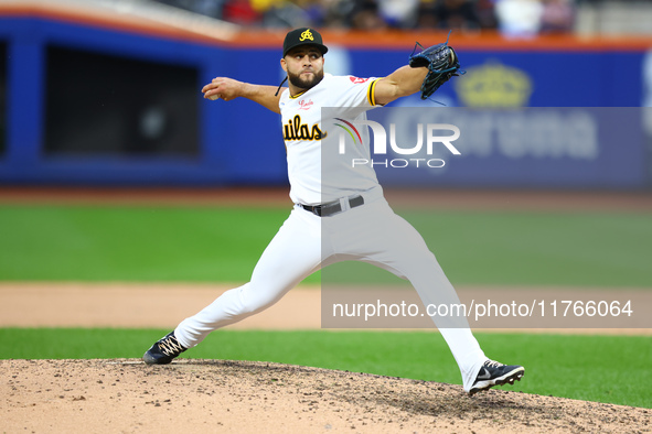 Las Aguilas Cibaenas pitcher Junior Fernandez #73 throws during the ninth inning of a baseball game against Los Tigres del Licey at Citi Fie...