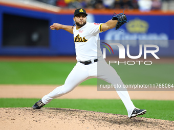 Las Aguilas Cibaenas pitcher Junior Fernandez #73 throws during the ninth inning of a baseball game against Los Tigres del Licey at Citi Fie...