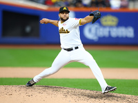 Las Aguilas Cibaenas pitcher Junior Fernandez #73 throws during the ninth inning of a baseball game against Los Tigres del Licey at Citi Fie...