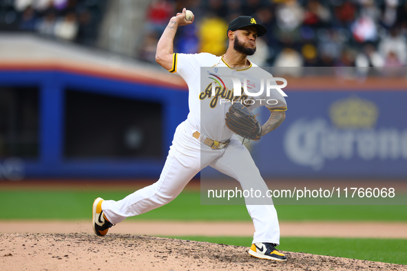 Las Aguilas Cibaenas pitcher Jonathan Hernandez #72 throws during the seventh inning of a baseball game against Los Tigres del Licey at Citi...