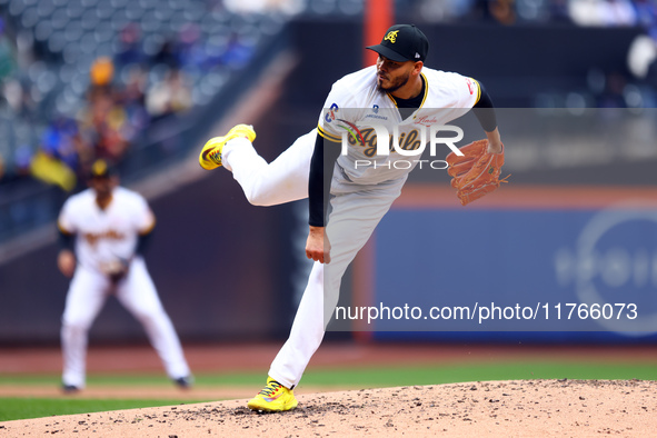 Las Aguilas Cibaenas pitcher Dinelson Lamet #71 throws during the third inning of a baseball game against Los Tigres del Licey at Citi Field...