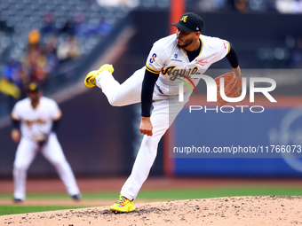 Las Aguilas Cibaenas pitcher Dinelson Lamet #71 throws during the third inning of a baseball game against Los Tigres del Licey at Citi Field...