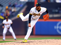 Las Aguilas Cibaenas pitcher Dinelson Lamet #71 throws during the third inning of a baseball game against Los Tigres del Licey at Citi Field...