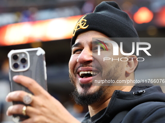 The Las Aguilas Cibaenas fans cheer during the baseball game against the Los Tigres del Licey at Citi Field in Corona, N.Y., on November 10,...