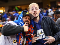 The Las Aguilas Cibaenas fans cheer during the baseball game against the Los Tigres del Licey at Citi Field in Corona, N.Y., on November 10,...