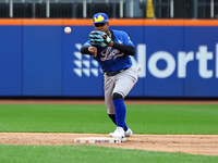 Los Tigres del Licey shortstop Domingo Leyba #6 fields and throws during the second inning of a baseball game against Las Aguilas Cibaenas a...