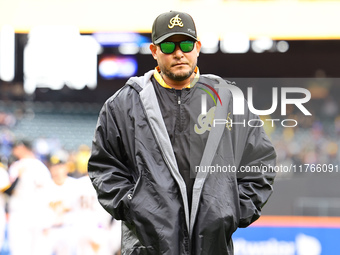 Las Aguilas Cibaenas manager Yadier Molina #11 comes off the field after a pitching change during the baseball game against Los Tigres del L...