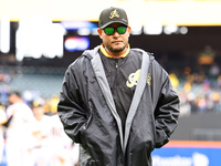 Las Aguilas Cibaenas manager Yadier Molina #11 comes off the field after a pitching change during the baseball game against Los Tigres del L...