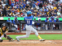 Liover Peguero #31 of Los Tigres del Licey bats during the third inning of a baseball game against Las Aguilas Cibaenas at Citi Field in Cor...