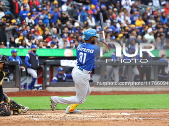 Liover Peguero #31 of Los Tigres del Licey bats during the third inning of a baseball game against Las Aguilas Cibaenas at Citi Field in Cor...