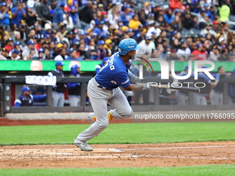 Liover Peguero #31 of Los Tigres del Licey bats during the third inning of a baseball game against Las Aguilas Cibaenas at Citi Field in Cor...