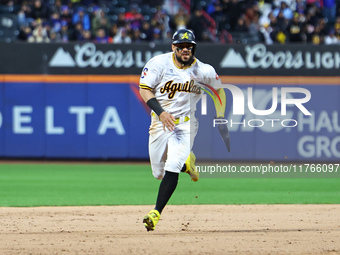 Yefri Perez #66 of Las Aguilas Cibaenas advances to third base during the ninth inning of a baseball game against Los Tigres del Licey at Ci...