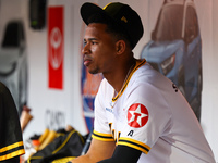 Alfredo Reyes #62 of Las Aguilas Cibaenas sits on the bench during the third inning of a baseball game against Los Tigres del Licey at Citi...