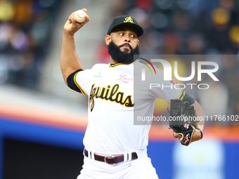 Las Aguilas Cibaenas pitcher Richard Rodriguez #19 throws during the eighth inning of a baseball game against Los Tigres del Licey at Citi F...