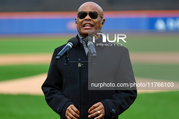 Merengue performer Rubby Perez sings the anthem of the Dominican Republic before the baseball game between Los Tigres del Licey and Las Agui...