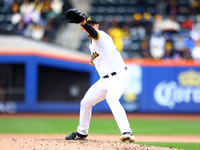 Las Aguilas Cibaenas pitcher Nick Wittgren #94 throws during the fourth inning of a baseball game against Los Tigres del Licey at Citi Field...