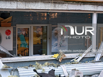 The facade of a residential building in the Khadzhybeiskyi district is damaged by a Russian drone attack in Odesa, Ukraine, on November 7, 2...