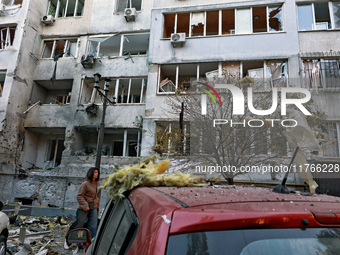 The facade of a residential building in the Khadzhybeiskyi district is damaged by a Russian drone attack in Odesa, Ukraine, on November 7, 2...