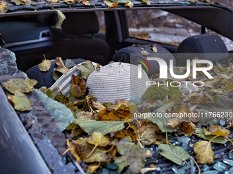 A woman's hat is in a car mutilated by a Russian drone attack in Khadzhybeiskyi district of Odesa, southern Ukraine, on November 7, 2024. (