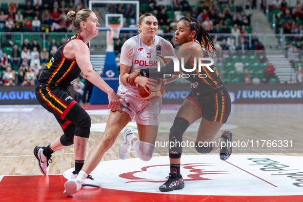 Emma Meesseman, Anna Makurat and  Maxuela Lisowa Mbaka in action during the FIBA 2025 European Women's Basketball Championship Qualifiers Gr...