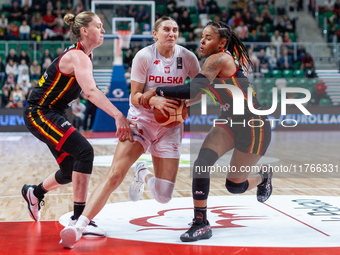 Emma Meesseman, Anna Makurat and  Maxuela Lisowa Mbaka in action during the FIBA 2025 European Women's Basketball Championship Qualifiers Gr...