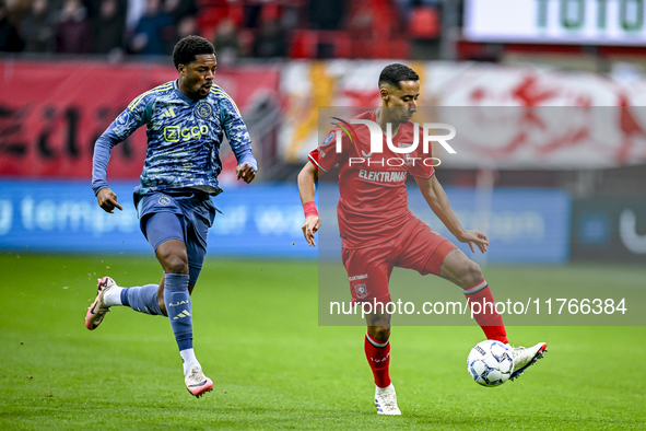 AFC Ajax Amsterdam forward Chuba Akpom and FC Twente defender Anass Salah-Eddine play during the match between Twente and Ajax at the Grolsc...