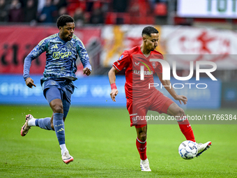 AFC Ajax Amsterdam forward Chuba Akpom and FC Twente defender Anass Salah-Eddine play during the match between Twente and Ajax at the Grolsc...