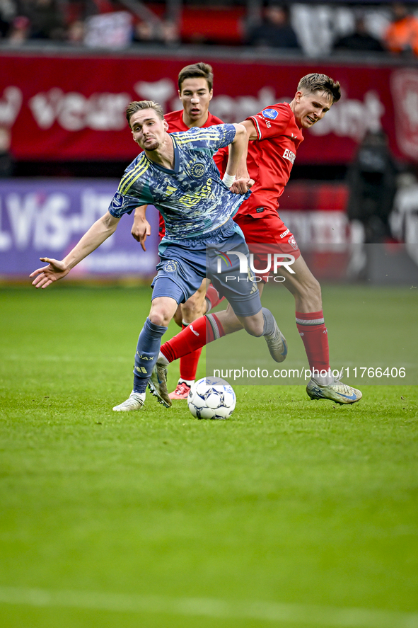 AFC Ajax Amsterdam midfielder Kenneth Taylor and FC Twente midfielder Gijs Besselink play during the match between Twente and Ajax at the Gr...