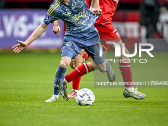 AFC Ajax Amsterdam midfielder Kenneth Taylor and FC Twente midfielder Gijs Besselink play during the match between Twente and Ajax at the Gr...