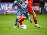 AFC Ajax Amsterdam midfielder Kenneth Taylor and FC Twente midfielder Gijs Besselink play during the match between Twente and Ajax at the Gr...