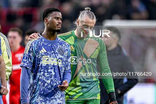 AFC Ajax Amsterdam defender Jorrel Hato and AFC Ajax Amsterdam goalkeeper Remko Pasveer participate in the match between Twente and Ajax at...