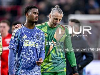 AFC Ajax Amsterdam defender Jorrel Hato and AFC Ajax Amsterdam goalkeeper Remko Pasveer participate in the match between Twente and Ajax at...