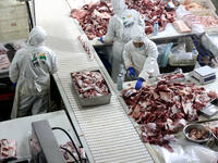 Workers divide beef at a workshop of a beef processing enterprise in Binzhou, China, on November 11, 2024. Global food prices rise in Octobe...