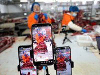 Workers divide beef at a workshop of a beef processing enterprise in Binzhou, China, on November 11, 2024. Global food prices rise in Octobe...