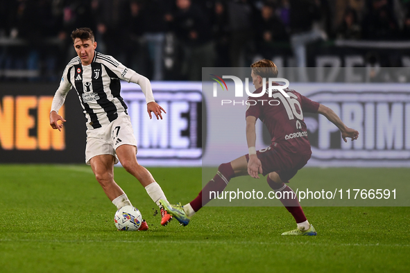 Andrea Cambiaso of Juventus battles for the ball with Marcus Pedersen of Torino during the Serie A match between Juventus and Torino FC at A...