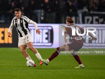 Andrea Cambiaso of Juventus battles for the ball with Marcus Pedersen of Torino during the Serie A match between Juventus and Torino FC at A...