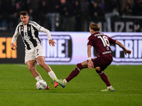 Andrea Cambiaso of Juventus battles for the ball with Marcus Pedersen of Torino during the Serie A match between Juventus and Torino FC at A...