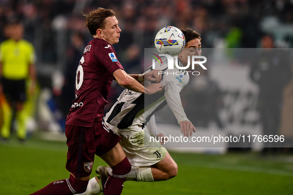 Marcus Pedersen of Torino battles for the ball with Kenan Yildiz of Juventus during the Serie A match between Juventus and Torino FC at Alli...