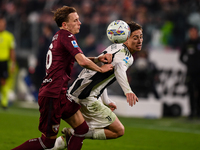 Marcus Pedersen of Torino battles for the ball with Kenan Yildiz of Juventus during the Serie A match between Juventus and Torino FC at Alli...