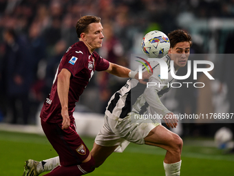 Marcus Pedersen of Torino battles for the ball with Kenan Yildiz of Juventus during the Serie A match between Juventus and Torino FC at Alli...