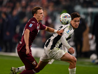 Marcus Pedersen of Torino battles for the ball with Kenan Yildiz of Juventus during the Serie A match between Juventus and Torino FC at Alli...