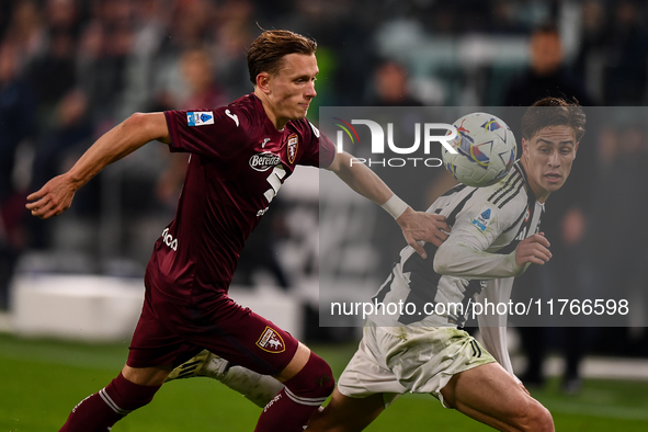 Marcus Pedersen of Torino battles for the ball with Kenan Yildiz of Juventus during the Serie A match between Juventus and Torino FC at Alli...