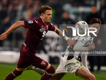 Marcus Pedersen of Torino battles for the ball with Kenan Yildiz of Juventus during the Serie A match between Juventus and Torino FC at Alli...