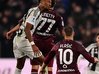 Khephren Thuram of Juventus battles for the ball with Karol Linetty of Torino during the Serie A match between Juventus and Torino FC at All...