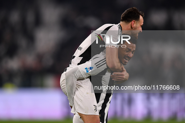 Juventus' Federico Gatti celebrates with Juventus' Danilo at the end of the Serie A match between Juventus and Torino FC at Allianz Stadium...